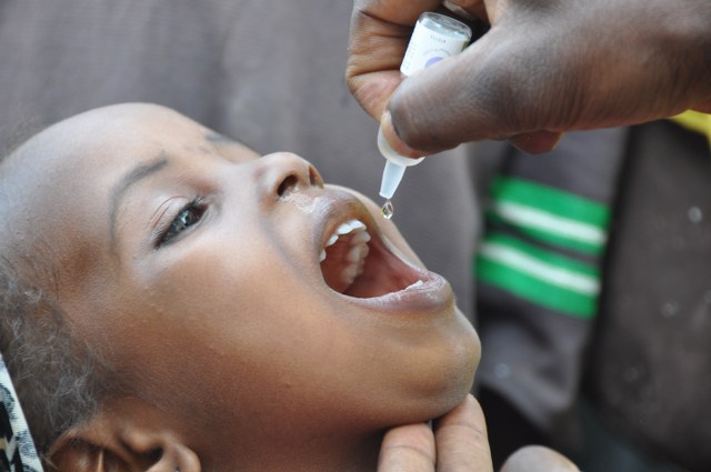 A child being administered drops